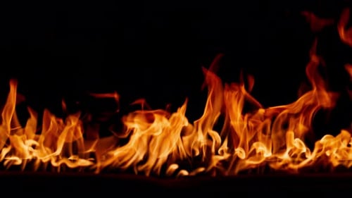Beautiful Dancing Fire Burning Flame Tongues of Orange Flame Bright Burning Flames on a Black
