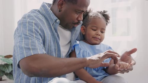 Cheerful Father Bonding With Daughter In Bright Home