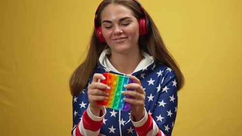 Woman Playing with a Rainbow Pop-It Fidget Toy