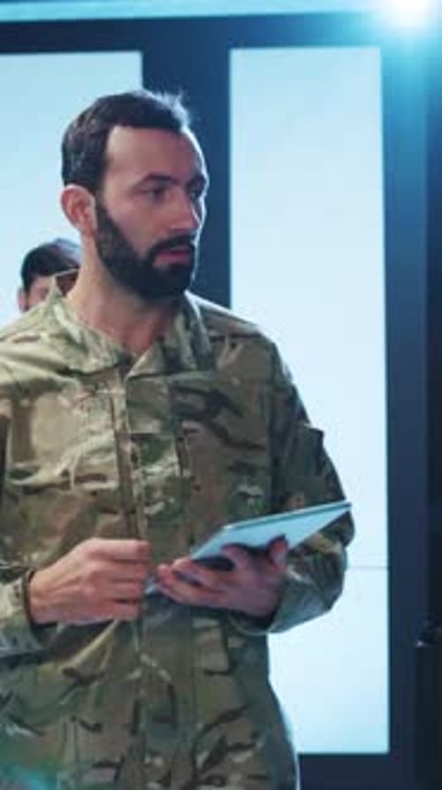 Men working on computers in a server room