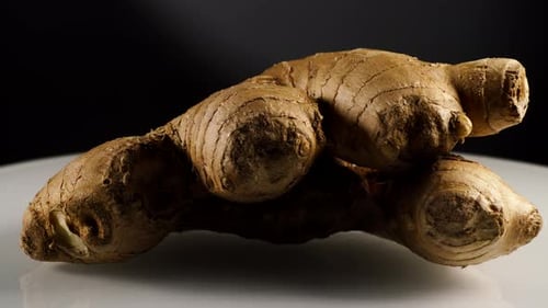 Ginger Root Close Up on White Surface