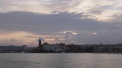 The City Skyline on Sunset Near the Water A Few Clouds on the Sky
