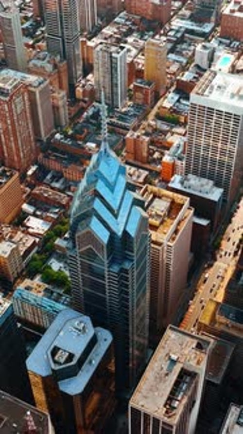 Panorama of sunny Philadelphia at daytime. Drone goes down above the luxurious skyscrapers.