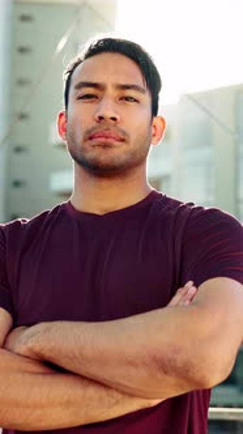 Man, arms crossed and face in city for fitness, confidence and break summer sunshine