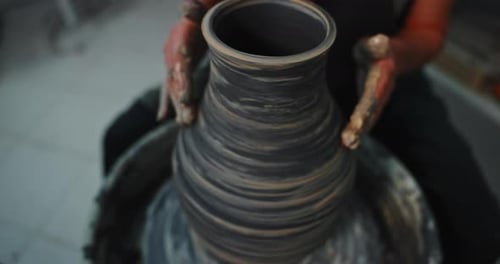 Potter Creates Vase on Spinning Wheel