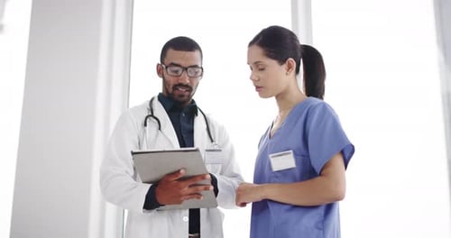 Hospital, research and doctor and nurse on tablet for medical service, discussion and medicine