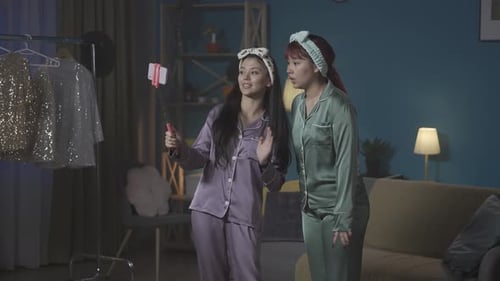 Young Women Vlogging in a Room at Night