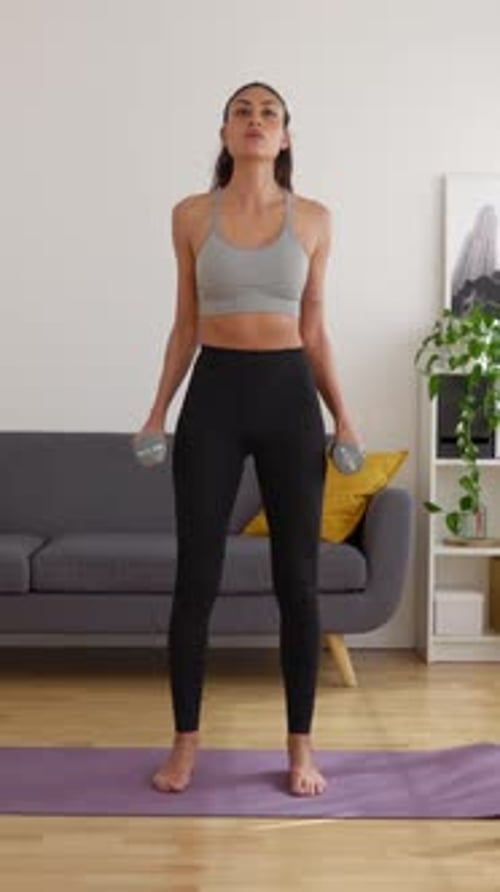 Woman Working Out at Home With Weights