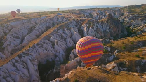 Hot Air Balloons Float Over Cappadocia at Sunrise