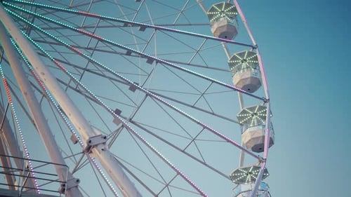 Old Fashioned Amusement Park View Vintage Amusement Wheel Illuminated in Warm Sunlight at Fairground