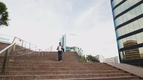 Businessman Descending Stairs in an Urban Setting