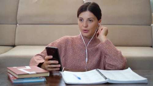Woman Studies with Smartphone Indoors