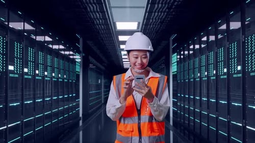 Asian Female Use Smartphone While Walking in Data Center