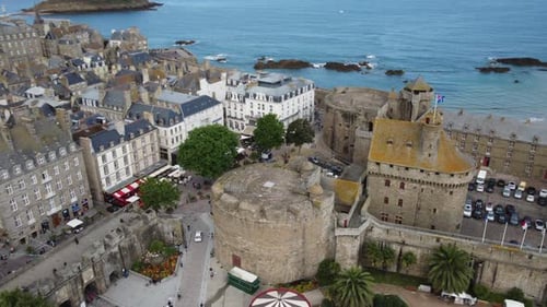 Drone flying over Saint-Malo city and medieval fortified castle, Brittany in France. Aerial view
