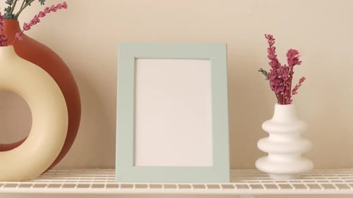 Decorative Shelf with Empty Frame and Flower Vase
