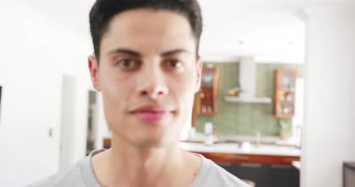 Smiling Man in Gray Shirt Indoors
