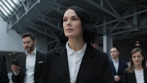 Successful businesswoman walks through modern office building after economic congress