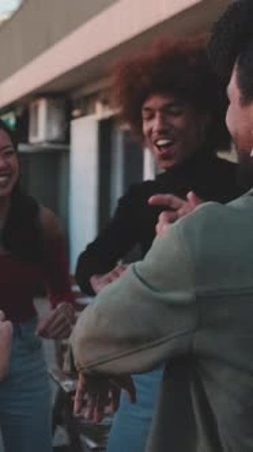 Group of Young Adults Dancing on a Rooftop