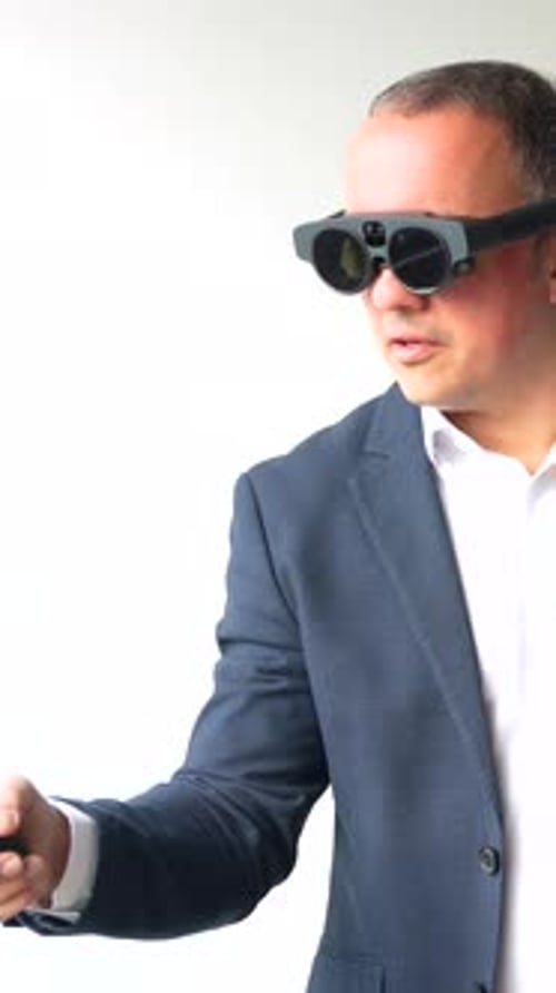Man Using Augmented Reality Glasses and Controller