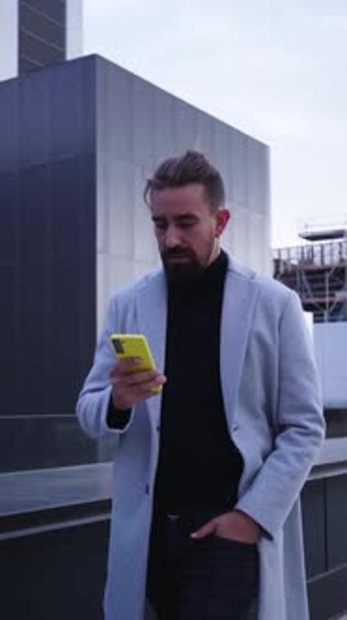 Businessman Walking Outside Financial District Using Phone Sending Text Messages on the Go