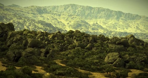 Rugged Mountains and Rocky Terrain Shine Under Bright Sunlight