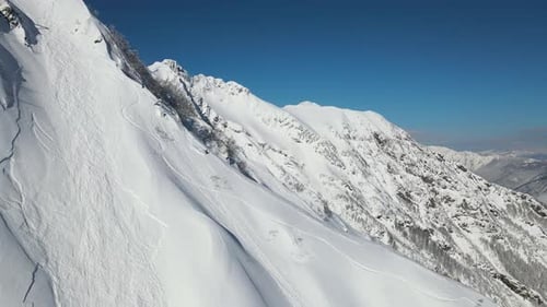 Snowy Mountains Aerial View on a Sunny Day