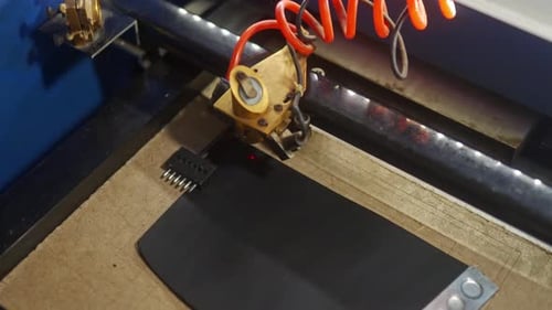 Top View of Moving Laser Head Block of Engraving Machine Engraves Picture on Leather Process of