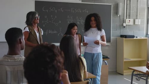 Students Presenting Chemistry Project in Classroom