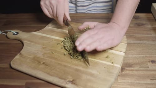 Finely chopping spices to prepare cafe de paris butter, perfect sauce for meats