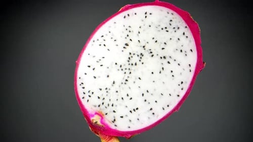 The vibrant hues and exotic textures of half a dragon fruit.