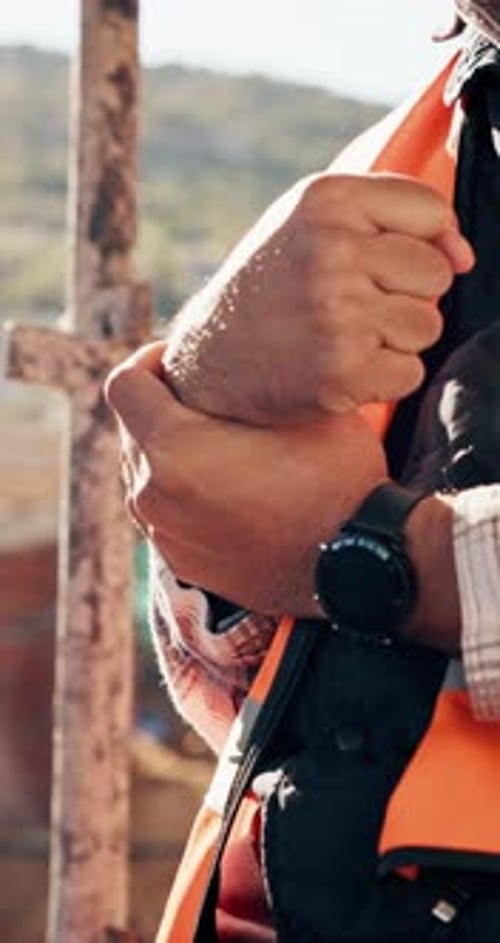 Construction, hands and man with wrist pain on site for physical strain, arthritis or work accident