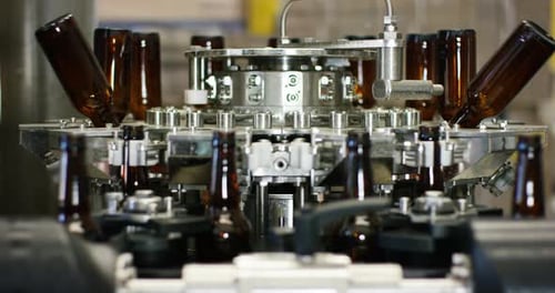 automated industrial chain of bottles for beer and alcoholic and soft drinks. the concept of indus