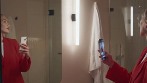 Woman Takes Mirror Selfies in Bathroom