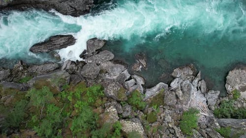 Beautiful Wilderness Tourquoise Mountain River Aerial View.
