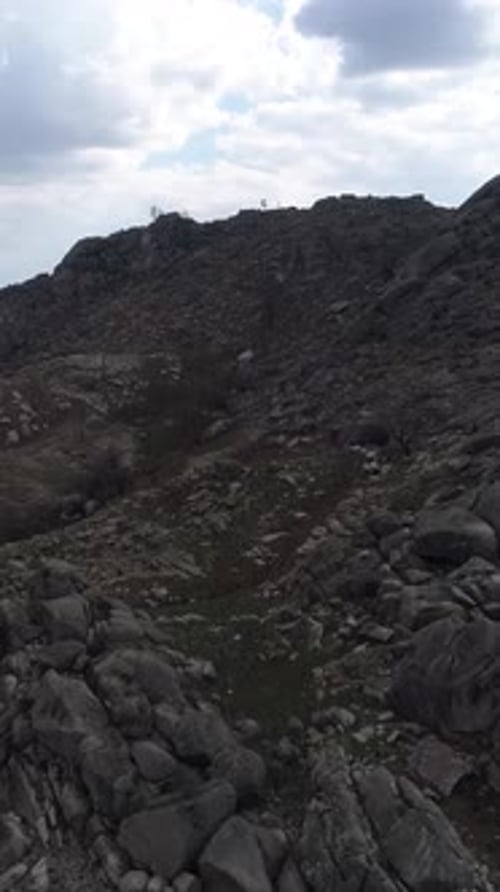 Vertical Video of High Mountains Rocks Formation Aerial View