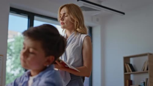 Children Doing Schoolwork in Classroom with Teacher