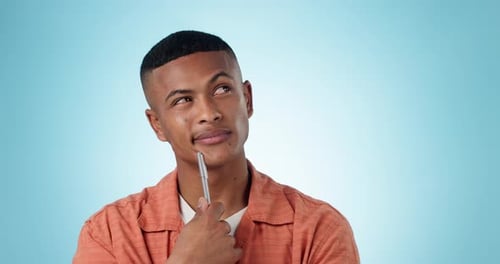Creative man, thinking and face for idea, solution or problem solving against a studio background