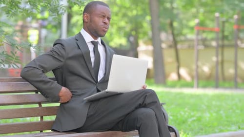 Adult Male Working on Laptop in Urban Park