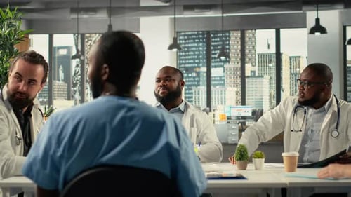 Medical Professionals Collaborating and Reviewing Data in Meeting