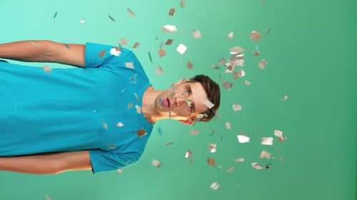 Young Adult Celebrates as Confetti Falls