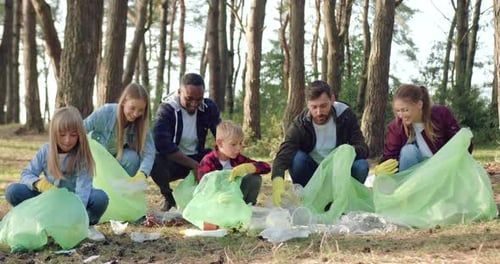 Diverse Group Cleaning Up Forest Litter in Spring