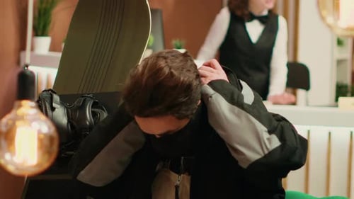 Man Puts on Protective Face Covering