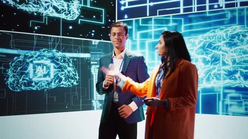 Presenter and Guest Talking at AI Summit Exploring Latest Tech Developments
