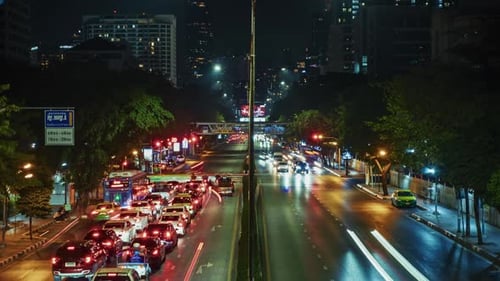 timelapse Nighttime Urban Traffic Flow with Light Trails in Modern City