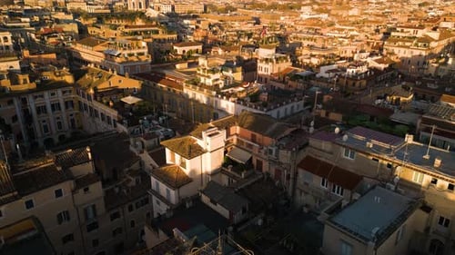 Cinematic Drone Shot Above Rome, Italy at Sunrise. Historic Italian Capital City on Beautiful Day