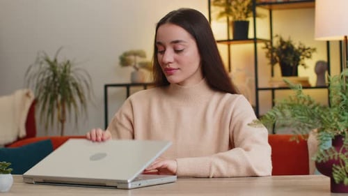 Young Woman Freelancer Sitting at Table Close Laptop Pc After Finishing Work in Office Room at Home