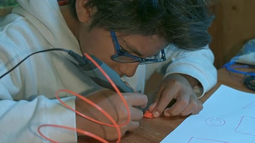 Child Creates Design with 3D Printing Pen at Home