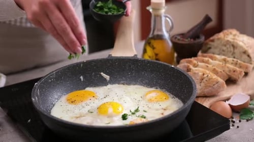 Seasoning Sunny Side Up Eggs with Fresh Herbs