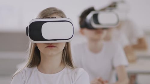 Children Using VR Headsets in Classroom Setting