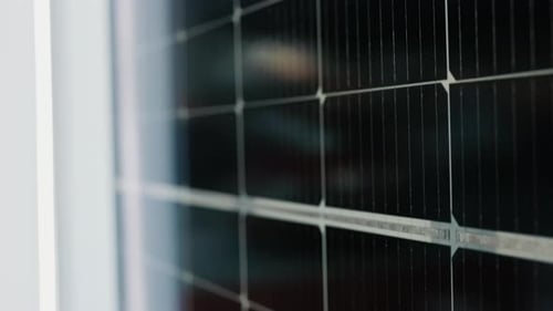 CloseUp View Of Black Solar Panels From Top To Bottom Solar Panels Absorbing The Sun's Energy Green